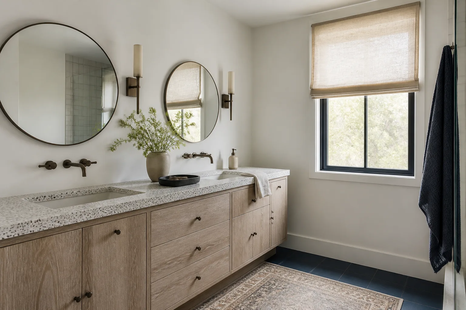 A wood double vanity with two mirrors after a bathroom remodel